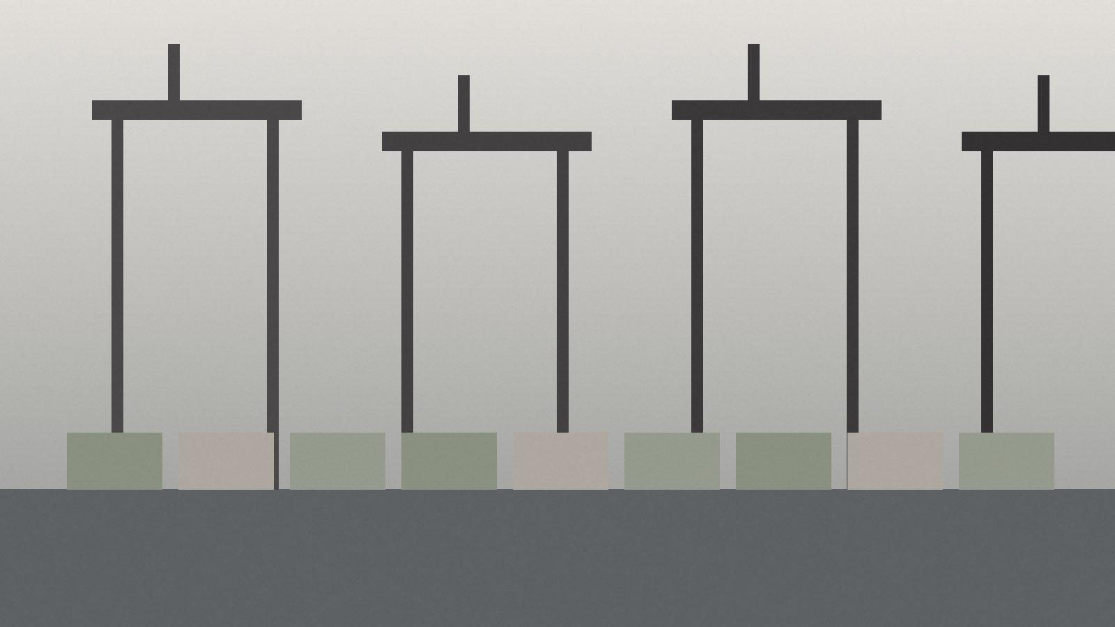 Gantry cranes working a container vessel at a Gulf port in morning haze
